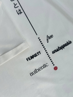 Load image into Gallery viewer, Close-up shot of graphic design on that back of white "Bold is to be" t-shirt. Ultra-soft organic cotton fabric. Comfortable and fashionable.