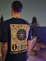 Load image into Gallery viewer, A close-up shot of the design on the back, standing outdoors at night.