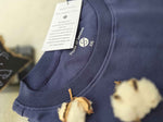Load image into Gallery viewer, Detailed shot of the Humble Human tees round neck collar with authentic House of SwaSha inside print with product tag