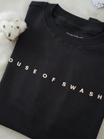 Load image into Gallery viewer, Close-up of House of SwaSha hunter green oversized men’s t-shirt featuring chest branding with non-PVC ink print