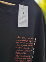 Load image into Gallery viewer, Close-up of Spirited Soul The Monk charcoal black oversized men’s t-shirt front graphic and chest print detail with tag