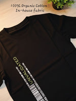 Load image into Gallery viewer, Flat lay view of House of SwaSha Unvalidated black classic fit men’s T-shirt laid flat on a table, showcasing full front with “Unvalidated” graphic print on chest, round neck, short sleeves, hem, and sustainable fabric.