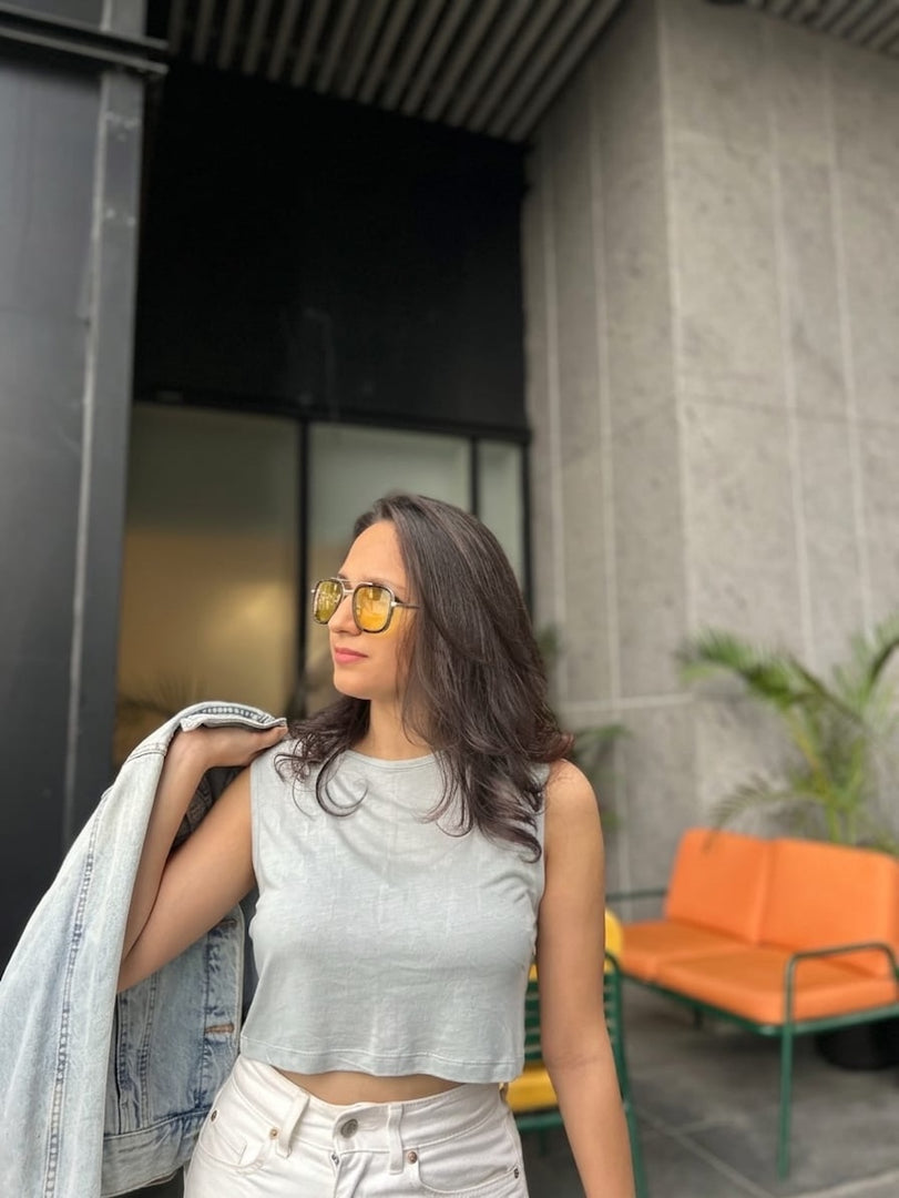 Woman wearing sunglasses and House of SwaSha Ash Gray tank top made out of 100% Bamboo fibres.