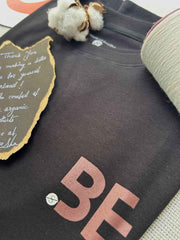 Close-up of BeLeaver charcoal black oversized men’s t-shirt showing round neck and soft organic cotton fabric texture