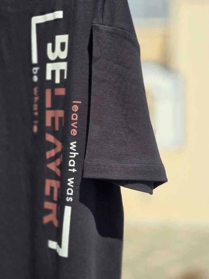 Side angle of House of SwaSha's BeLeaver charcoal black oversized men’s t-shirt in 210 GSM organic cotton