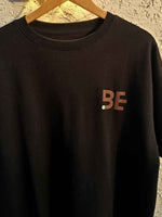 Load image into Gallery viewer, BeLeaver charcoal black oversized men’s t-shirt front view on hanger against plain background 