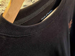 Load image into Gallery viewer, Detailed shot of the BeLeaver tees round neck collar with authentic House of SwaSha inside print
