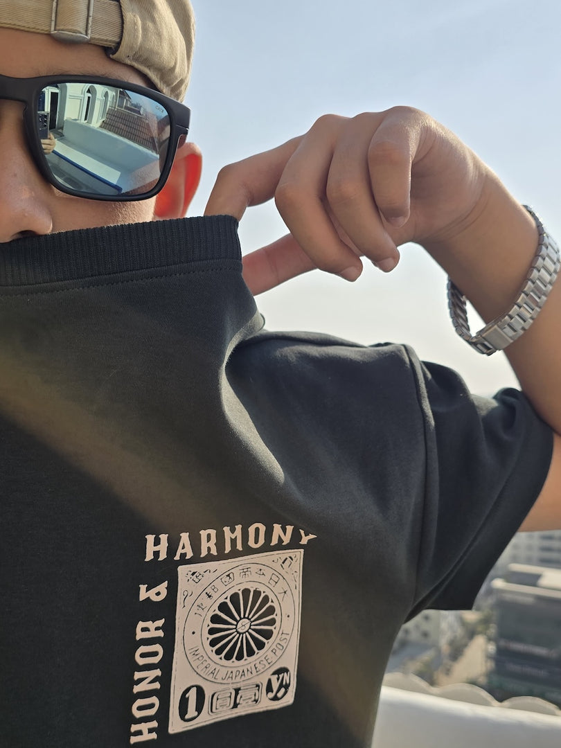 Honour and Harmony hunter green oversized men’s t-shirt front view on model, round neck half sleeves, organic cotton 210 GSM