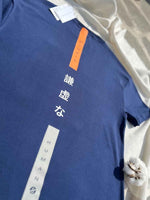 Load image into Gallery viewer, Close-up of Humble Human navy blue oversized men’s t-shirt focusing on back print 