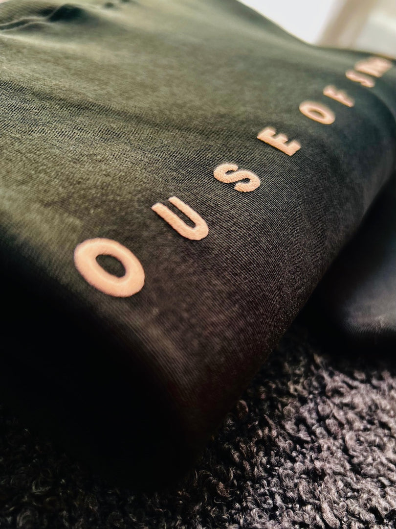 Detailed shot of a hunter green fabric with non-pvc ink print