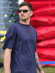House of SwaSha navy blue oversized men’s t-shirt three-quarter front angle on model highlighting the fabric and fall 