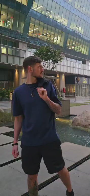 House of SwaSha navy blue oversized men’s t-shirt on model in motion highlighting fabric flow